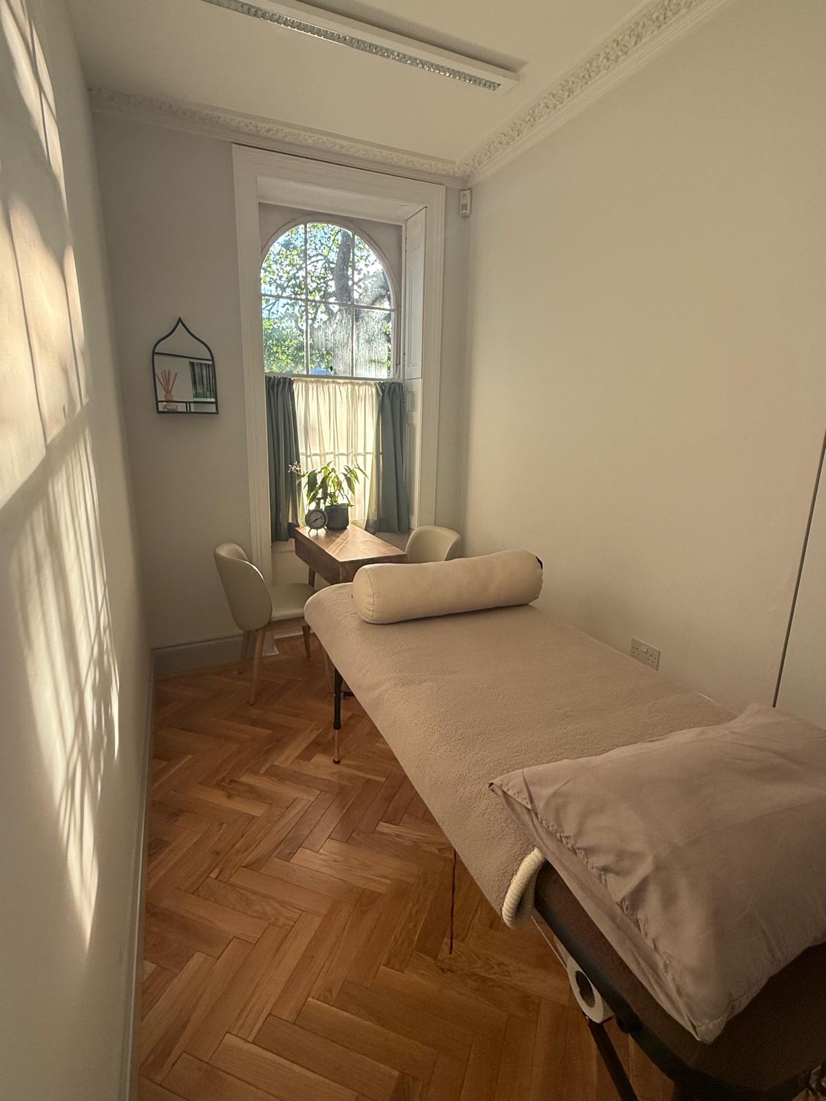 The calm, light-filled yoga therapy room at Cornerstone Studios